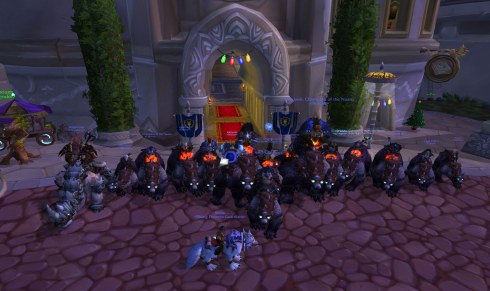 Group of Horde toons riding warbears in front of the Alliance Inn in Dalaran.